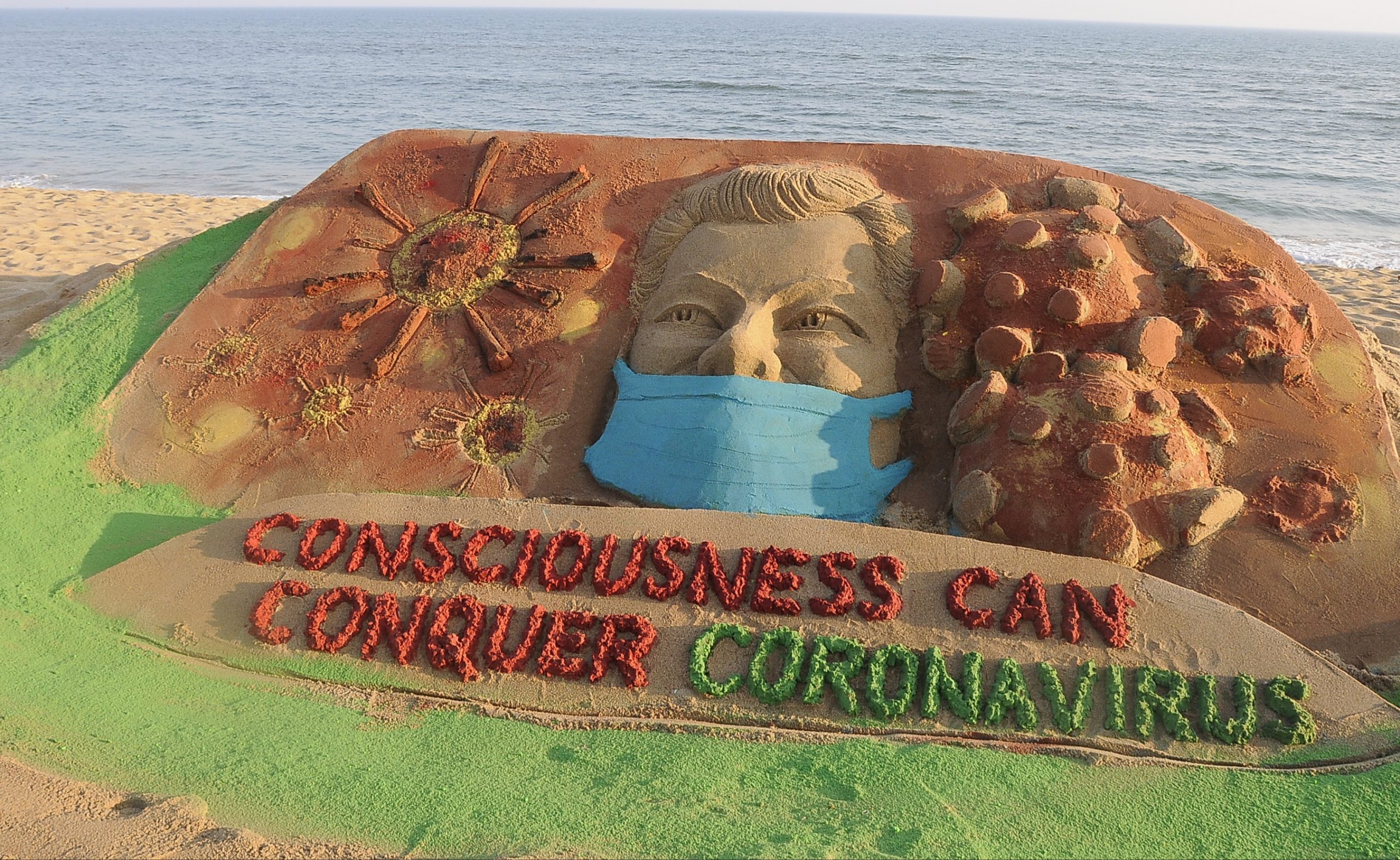 Coronavirus in sand art on Puri beach India Whispers